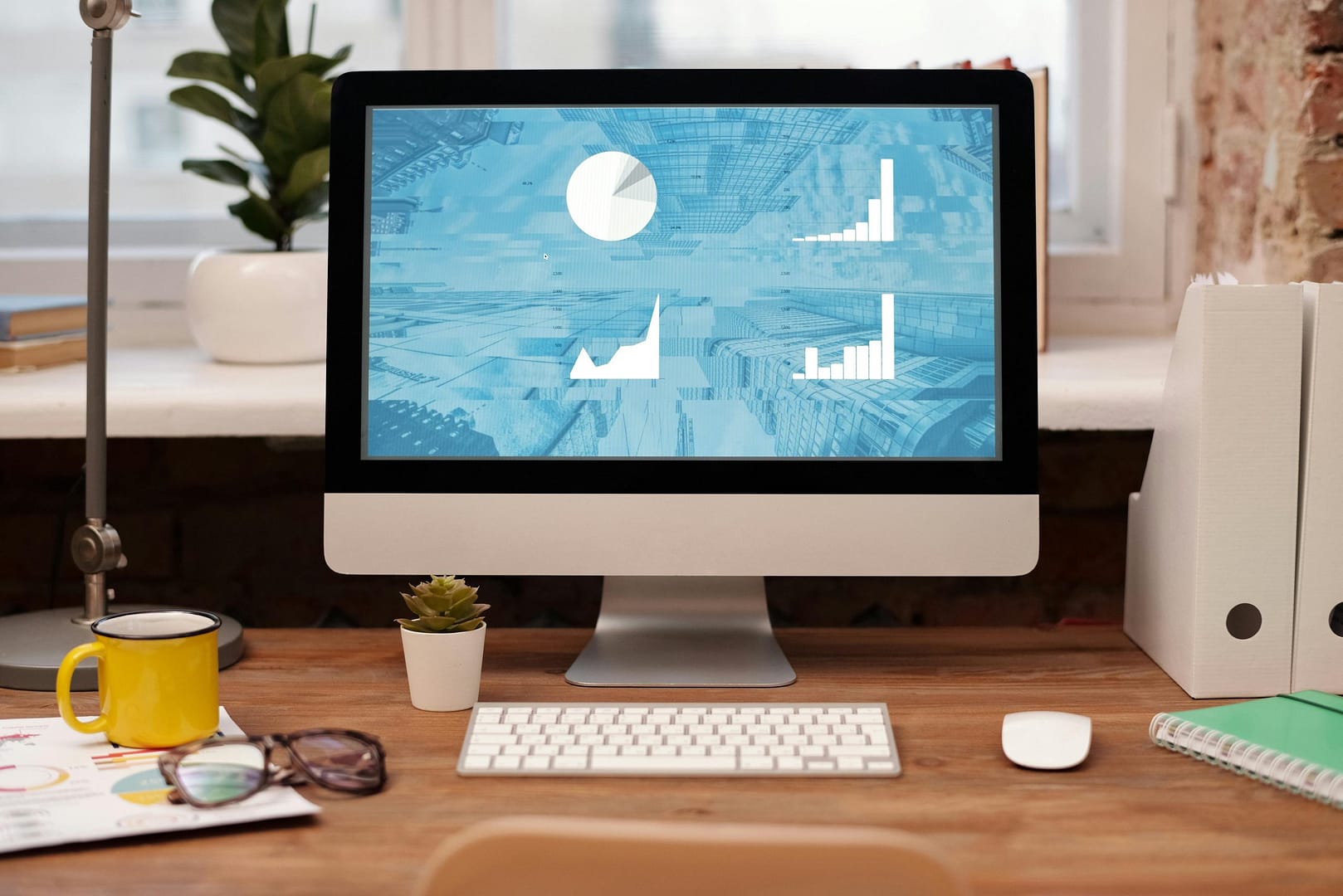 Modern workspace with desktop computer and natural light