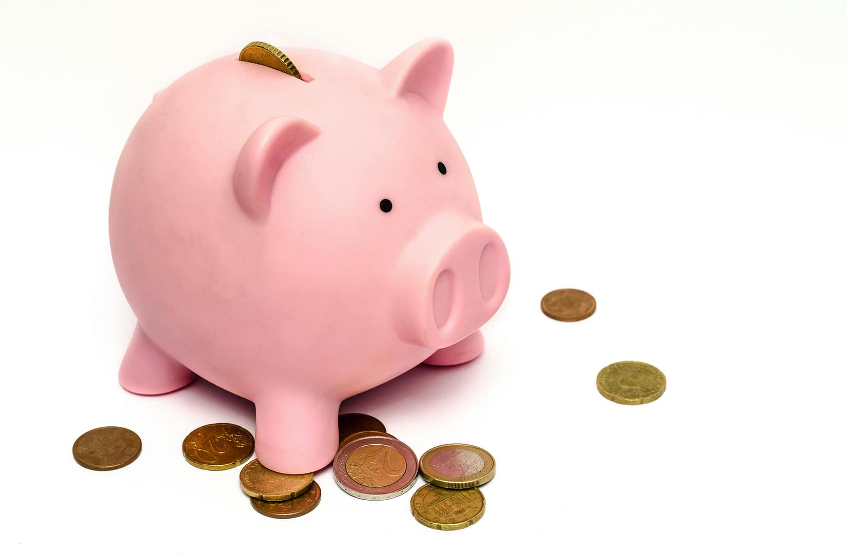 piggy bank and coins illustrating landing page vs full website cost comparison