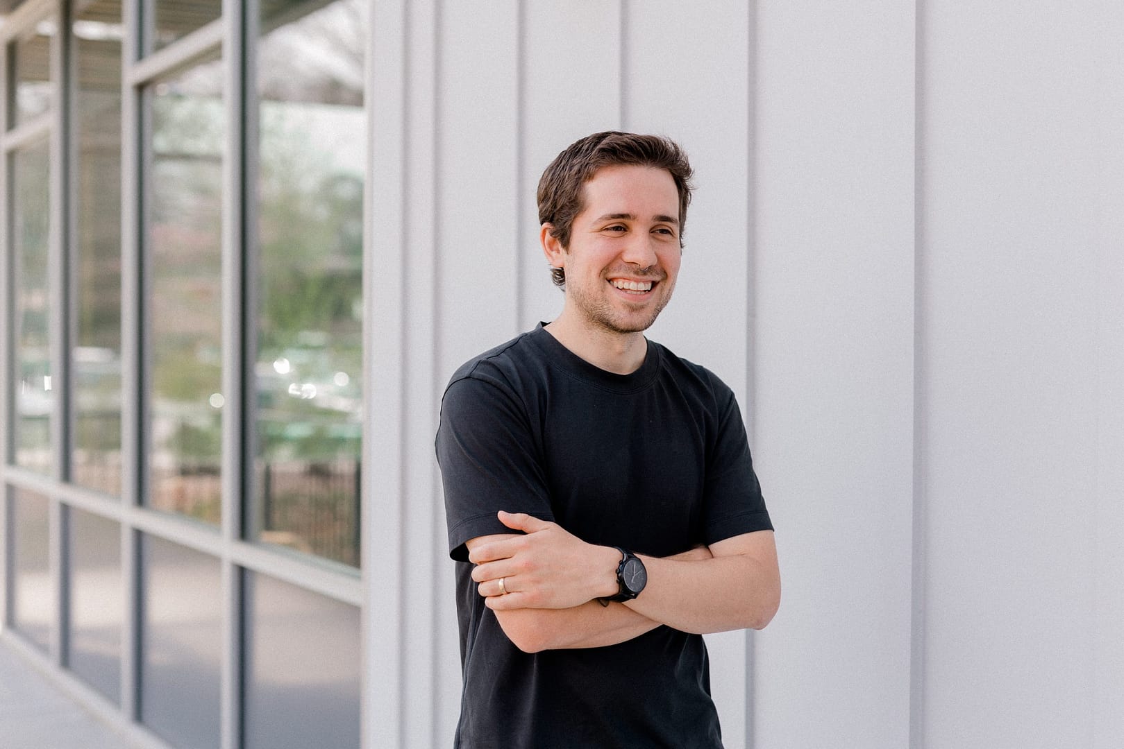 Watch Co-owner Taylor stands outside laughing